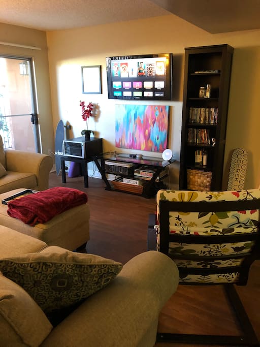Mounted flat screen with Apple TV, Netflix, you tube, Hulu and so much more... Just sign in! Our Netflix and YouTube is shareable so help yourself. You can see a nice large patio with a bar and seating for six. Wii and DVD player as well!