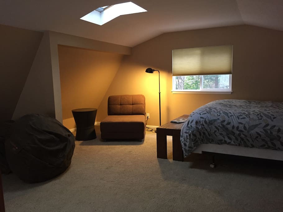 Upstairs Loft with Queen bed. Two fold out chairs turn into single bed mattress pads on the floor.