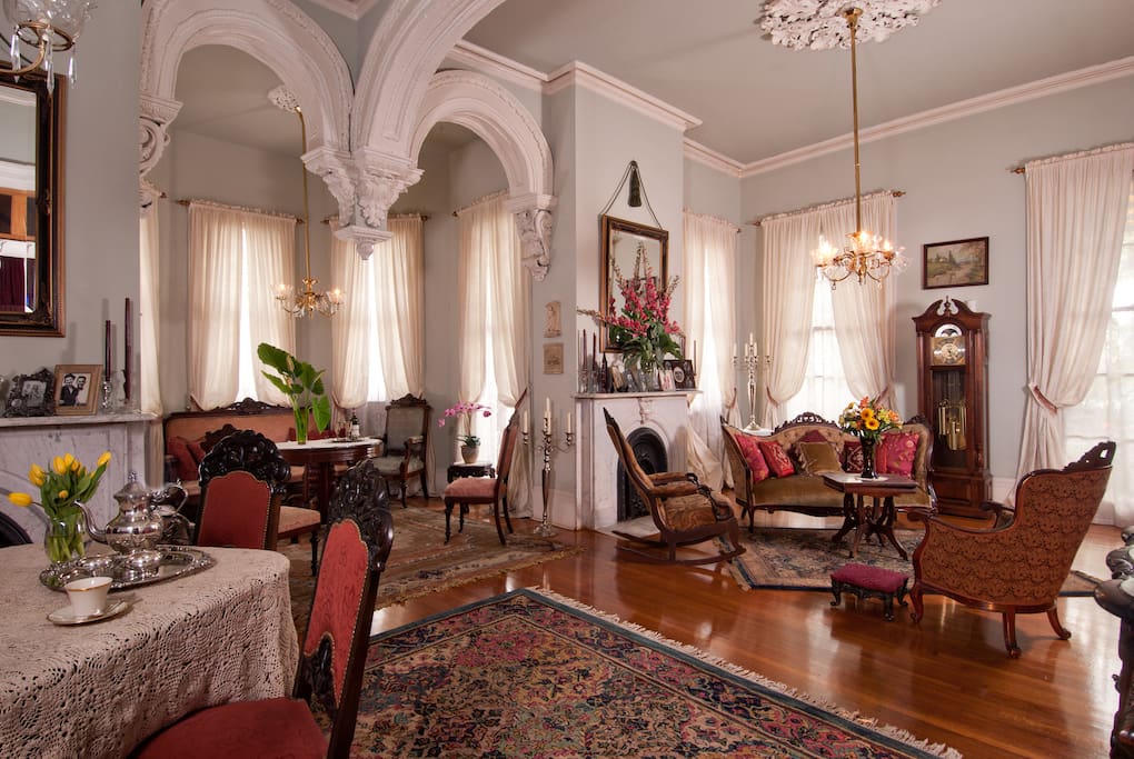 Bask in the elegant grandeur of the home's formal double parlor.