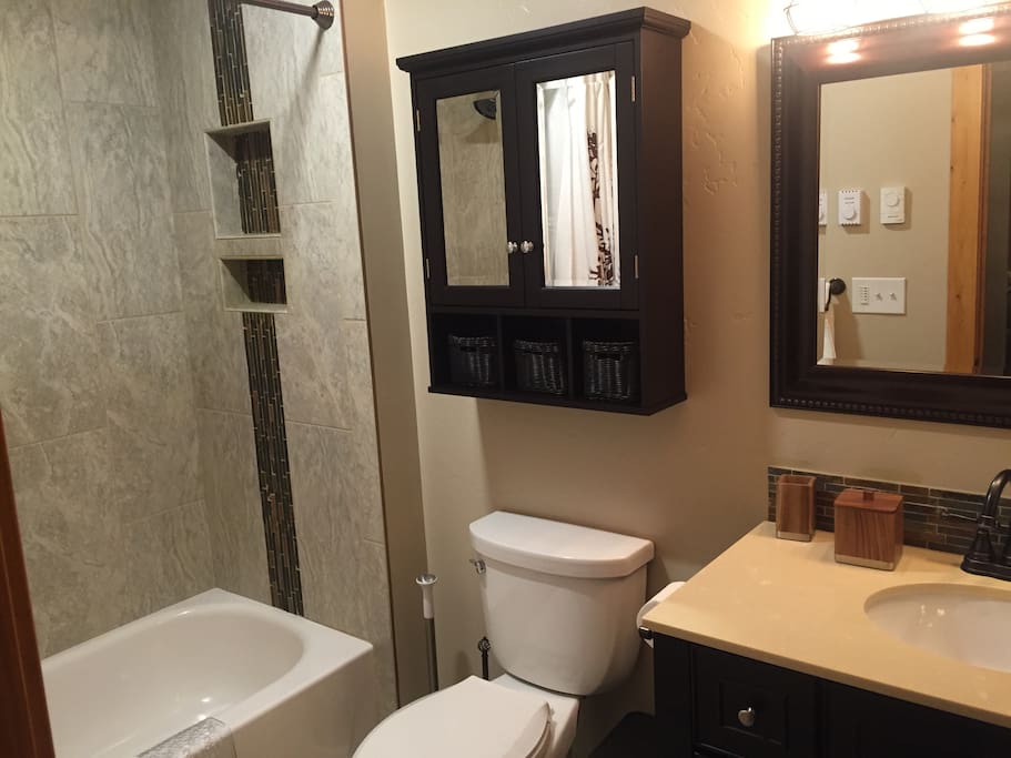 Full tub in bathroom and heated title floors.
