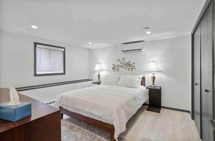 Rest easy in the spacious bedroom with a plush king bed, perfect for a peaceful night’s sleep