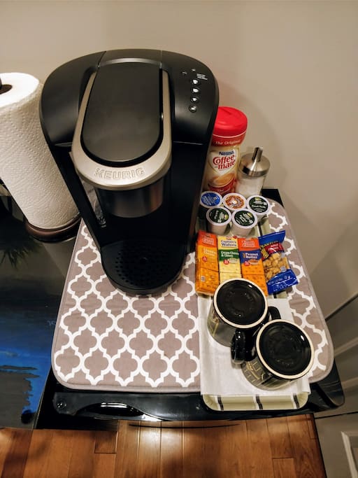 Minifridge with Keurig coffee maker, snacks, and water
