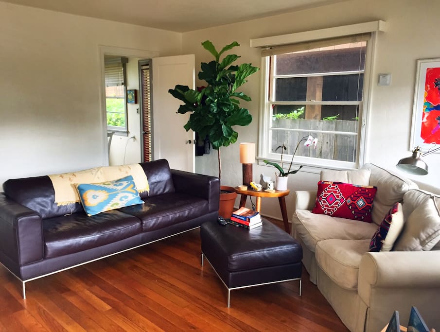 Living room showing both couches and ottoman. Futon can be added at request.