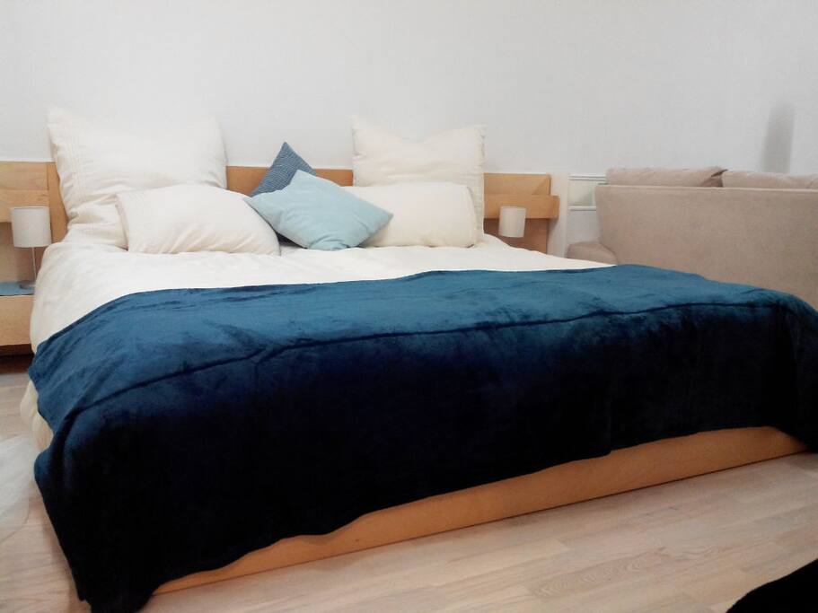 King Sized Bed with 4 Pillows and choice of 2 Single or 1 King Sized Duvet