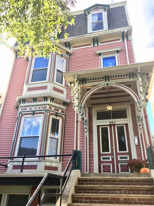 Exterior of home. Unit is on second floor with the bay window.