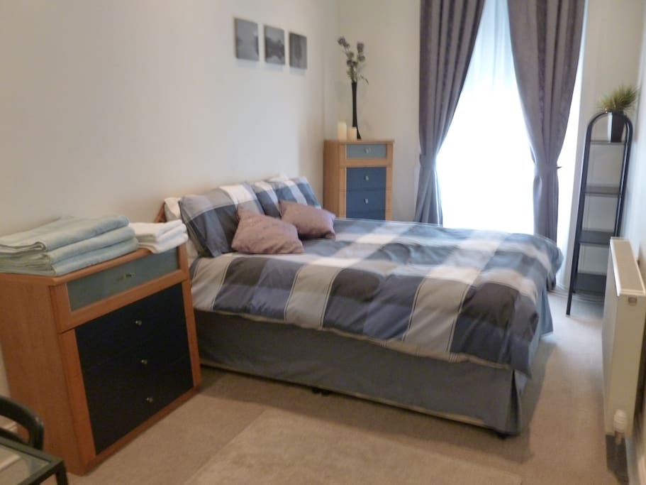 Bedroom with selection of towels and soap