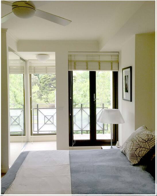 Master bedroom with queen size bed, ensuite, fan and aircondlting and private balcony in the room.