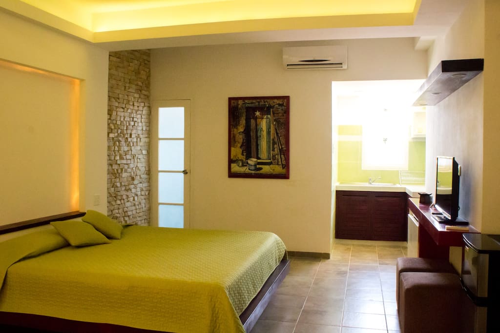 King size bed and bathroom entrance