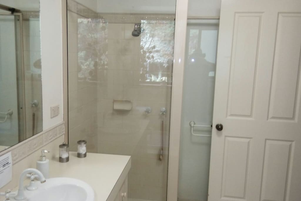 Shared bathroom with a privacy lock and a separate toilet