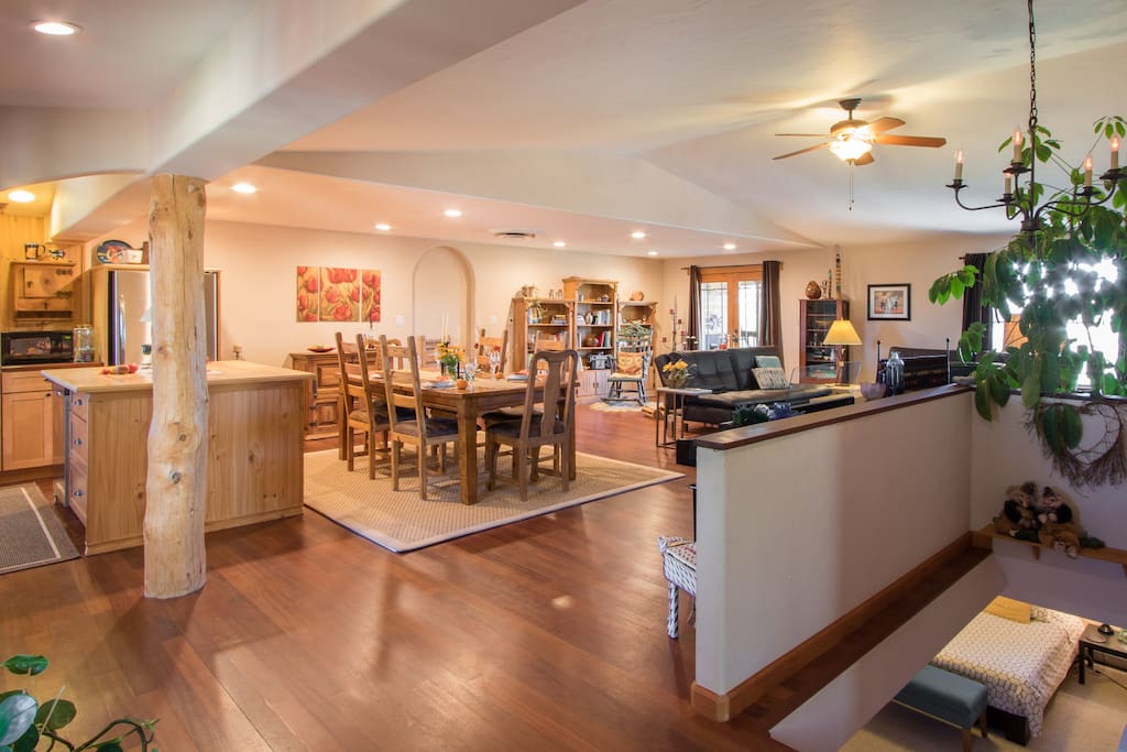 Spacious Southwestern family style kitchen with view of lower level bedroom.
