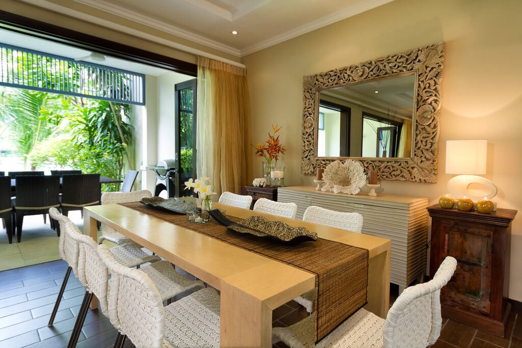 Indoor and outdoor dining areas comfortably seat 8.