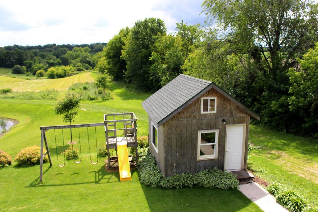 View from Chalet balcony of walking trails and swingset.