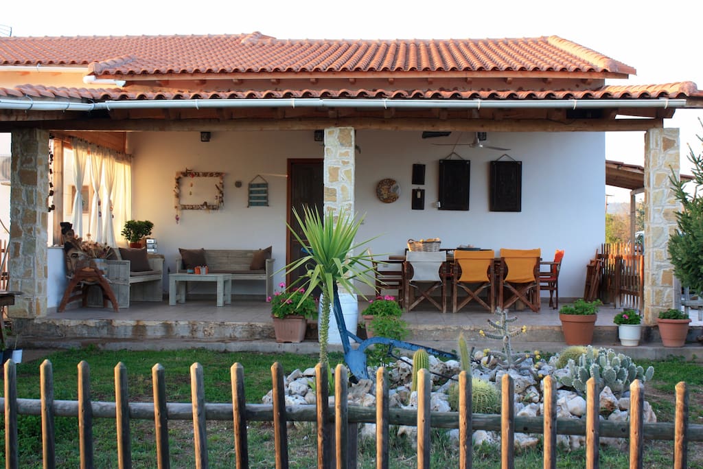 The lovely veranda where you can enjoy your coffee or share a meal around the enormous table.