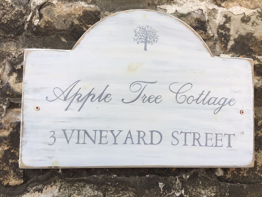 Our hand painted, bespoke sign for the cottage which is named after the gorgeous apple tree in the garden