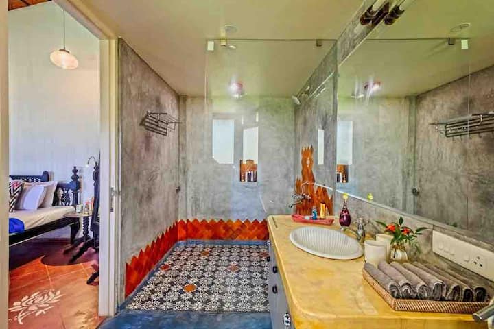 The bathroom here too is delightful and is loved by guests due to their size and eclectic design.