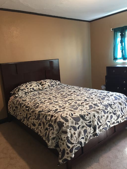 Comfortable queen sized bed in spacious downstairs bedroom.