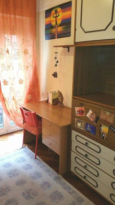 ...provided with a desk and a wide closet