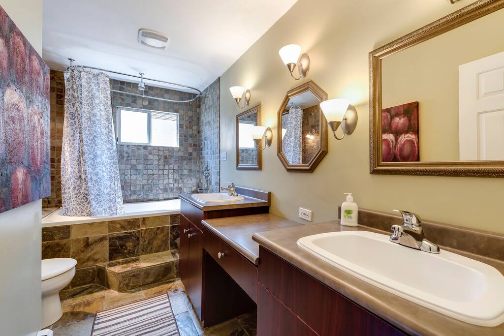 Second floor shared bathroom with soaker tub , rain shower, 2 sinks