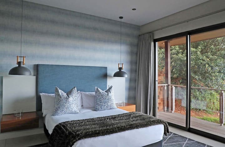 Second bedroom with a queen size bed and its' own inter leading bathroom