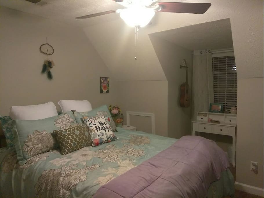 bedroom with queen bed, tv with DVD player and Netflix/Hulu, and dresser and closet space.