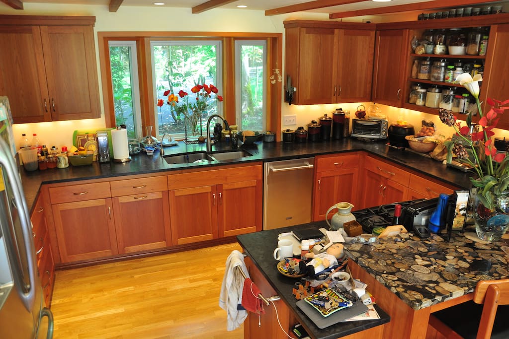 open custom kitchen with peninsula and stools.