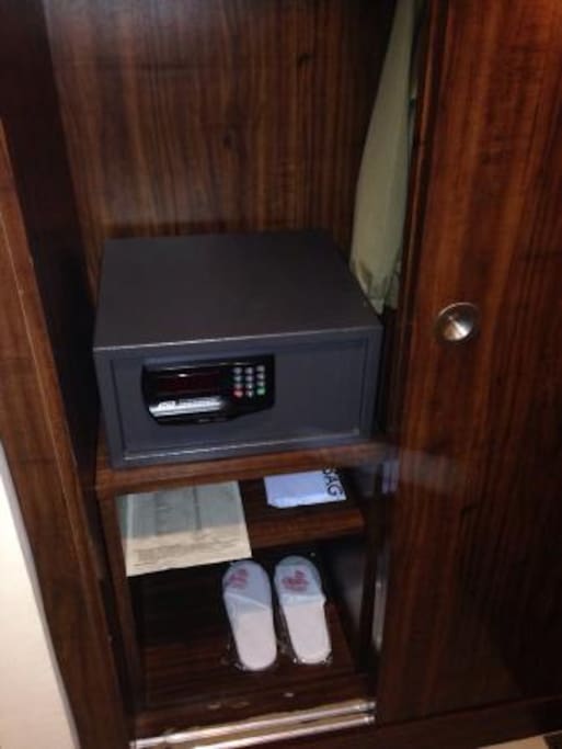 Closet with safe and complimentary slippers