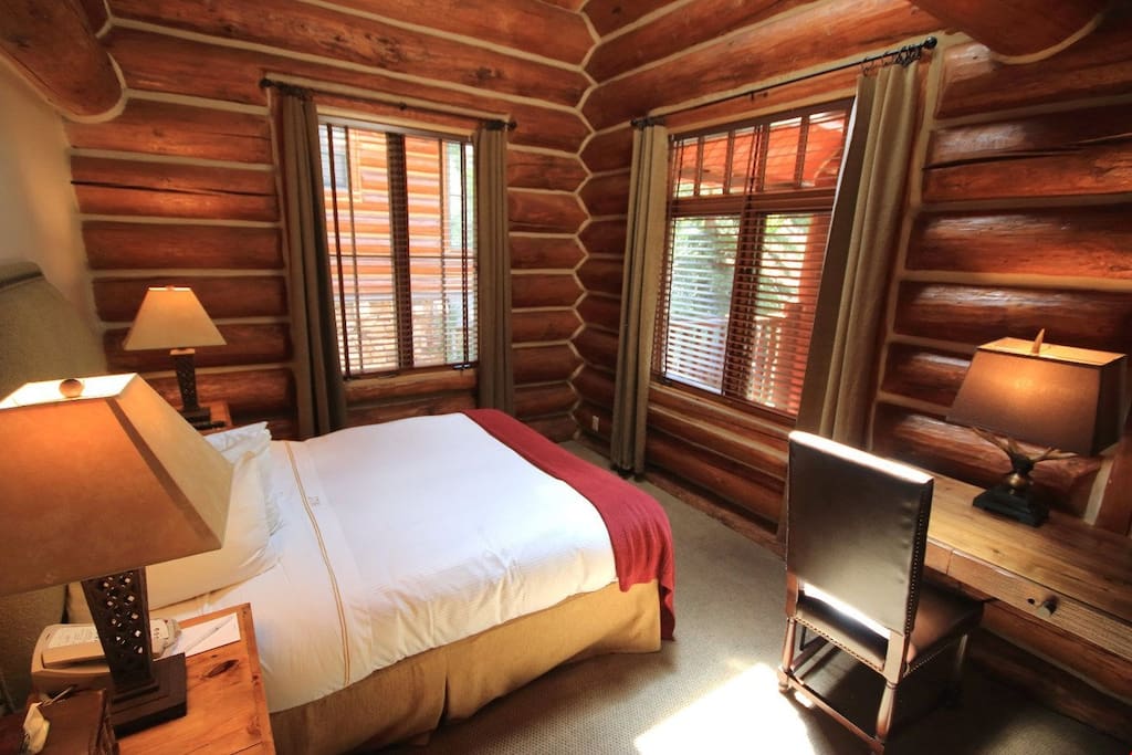 Enjoy this cozy wooden style bedroom. Photos are rep