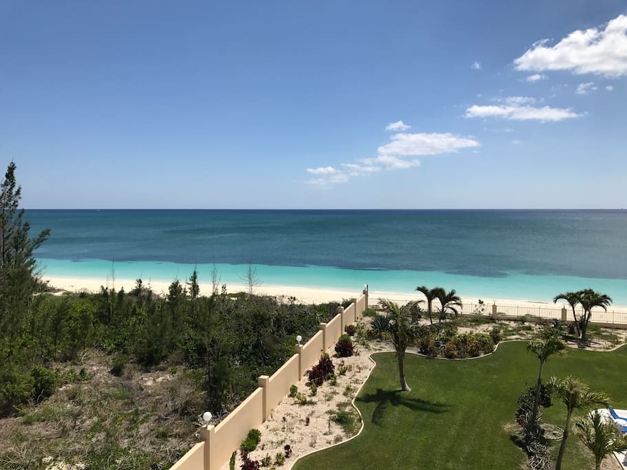 view of beach and pool from balcony