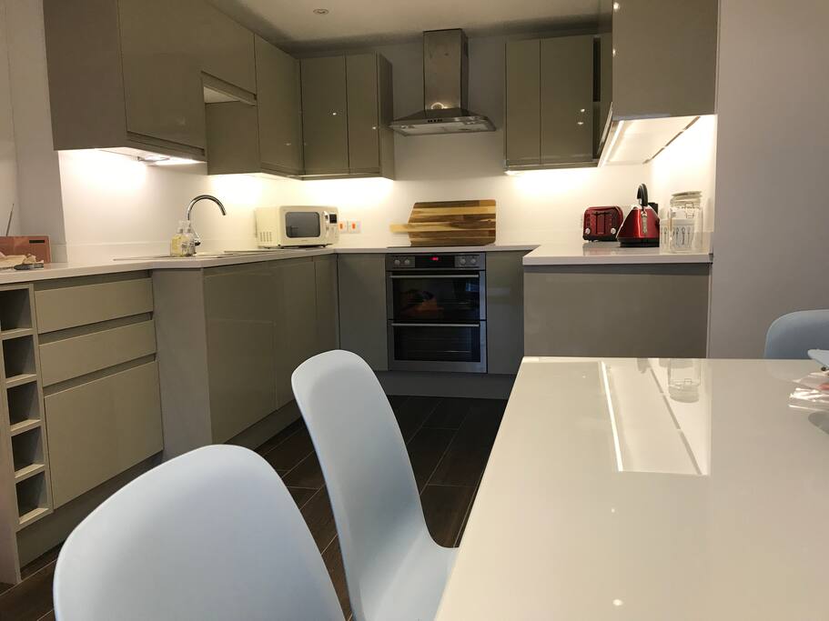 Brand new kitchen/dining room with bifold doors leading to garden with 8ft trampoline with safety walls
