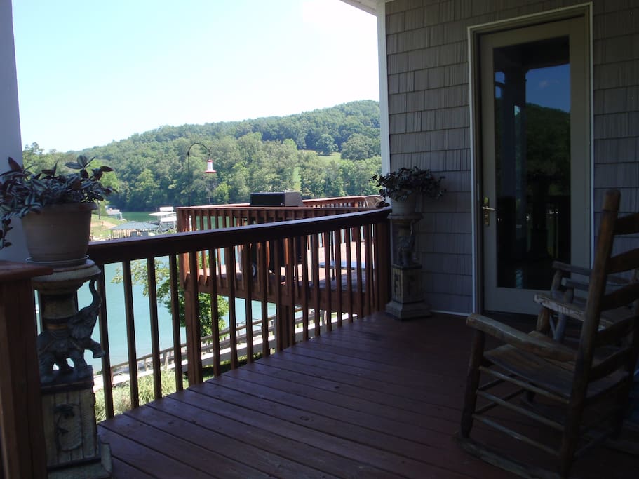 Entry door with rocking chairs and lake view