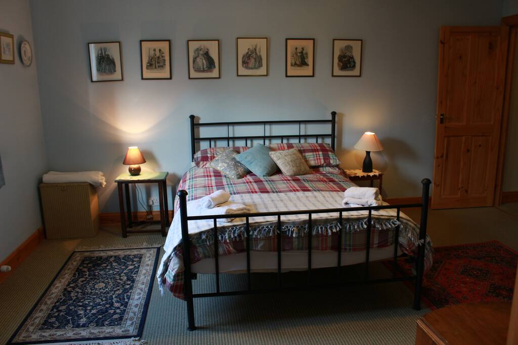 Master bedroom with ensuite bathroom situated on the ground floor.