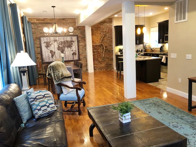 Luxury 3-story townhome w/ exposed brick & 2 decks