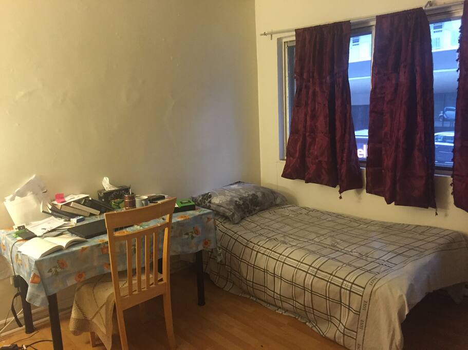 There is a table and a single in the living room.