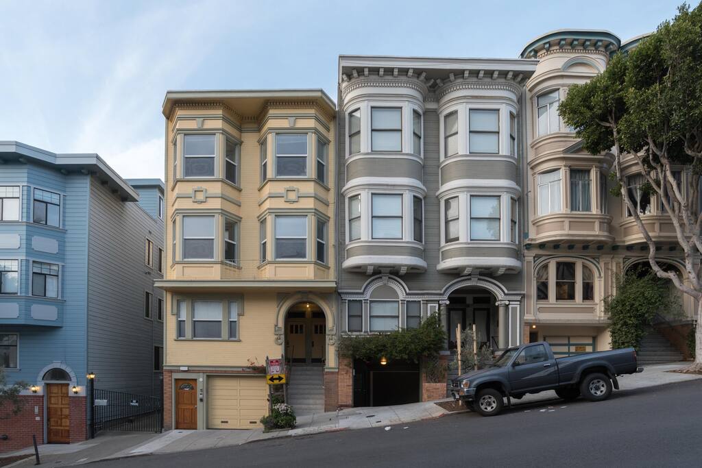 View from Street. Yellow house.