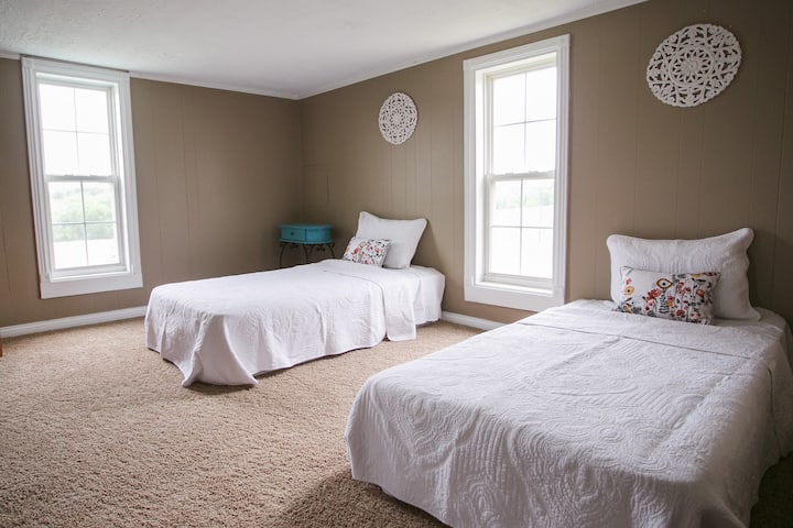 Two of the four twin beds in common room upstairs.