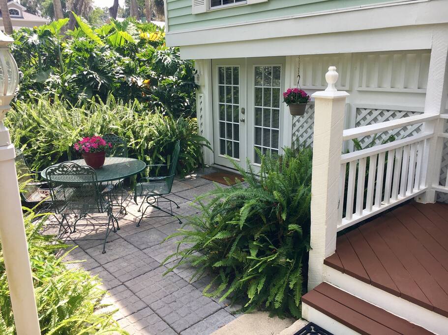 The guest suite entrance is on the ground level with a private outside courtyard patio area.