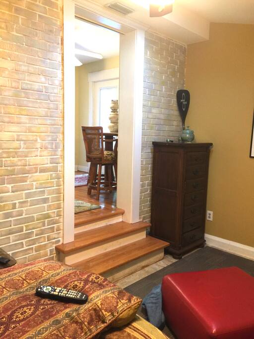 Three steps separate bedroom from kitchen