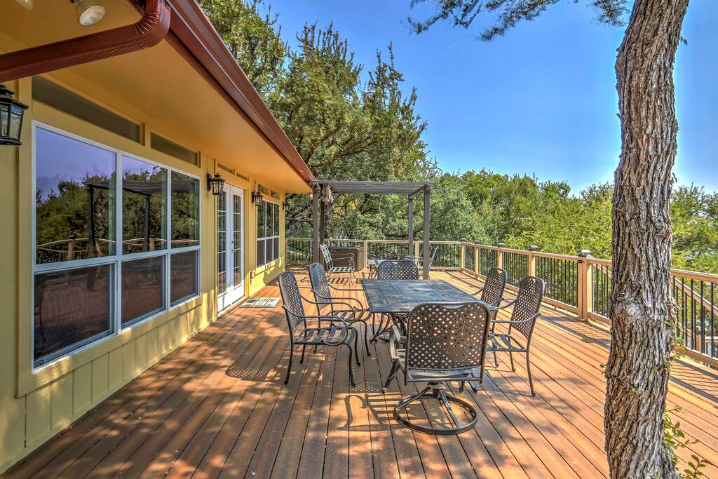 This waterfront, 5,000-square-foot home comfortably sleeps 18 guests and features a boat dock, tennis court, basketball hoops and more!