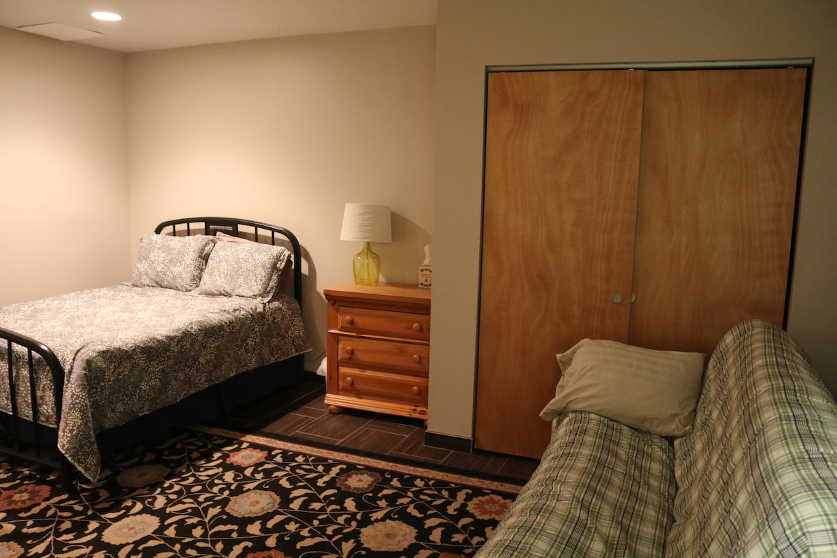 This is the basement with both the futon and the extra bed.