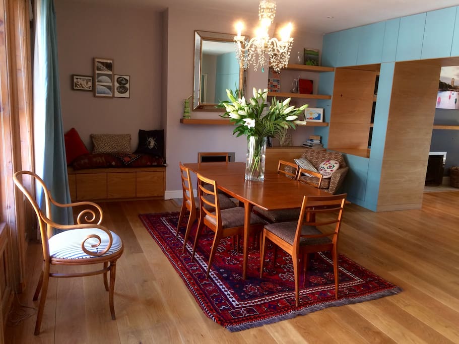 The apartment has an enormous open-plan living space encompassing a kitchen, dining area and sitting room.