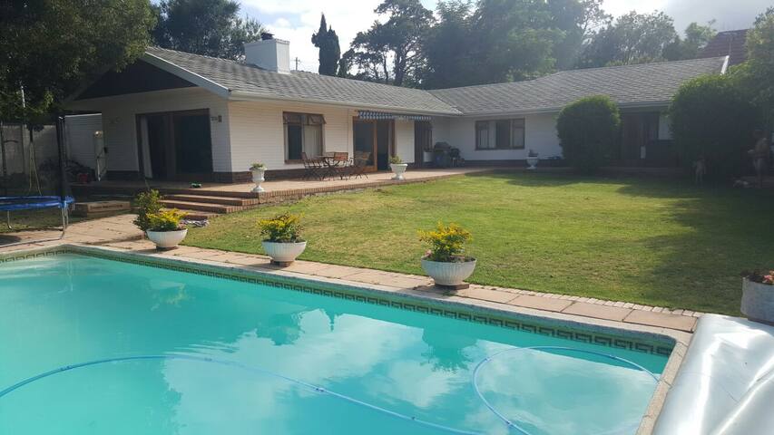 Cheerful home with garden, pool & pizza deck. gallery image 2