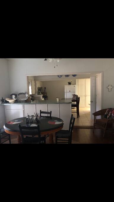 Table sits 6. Cowboy dinnerware for 8. Kitchen has bar table for 2, dishwasher, microwave, stove/oven, refrigerator toaster oven