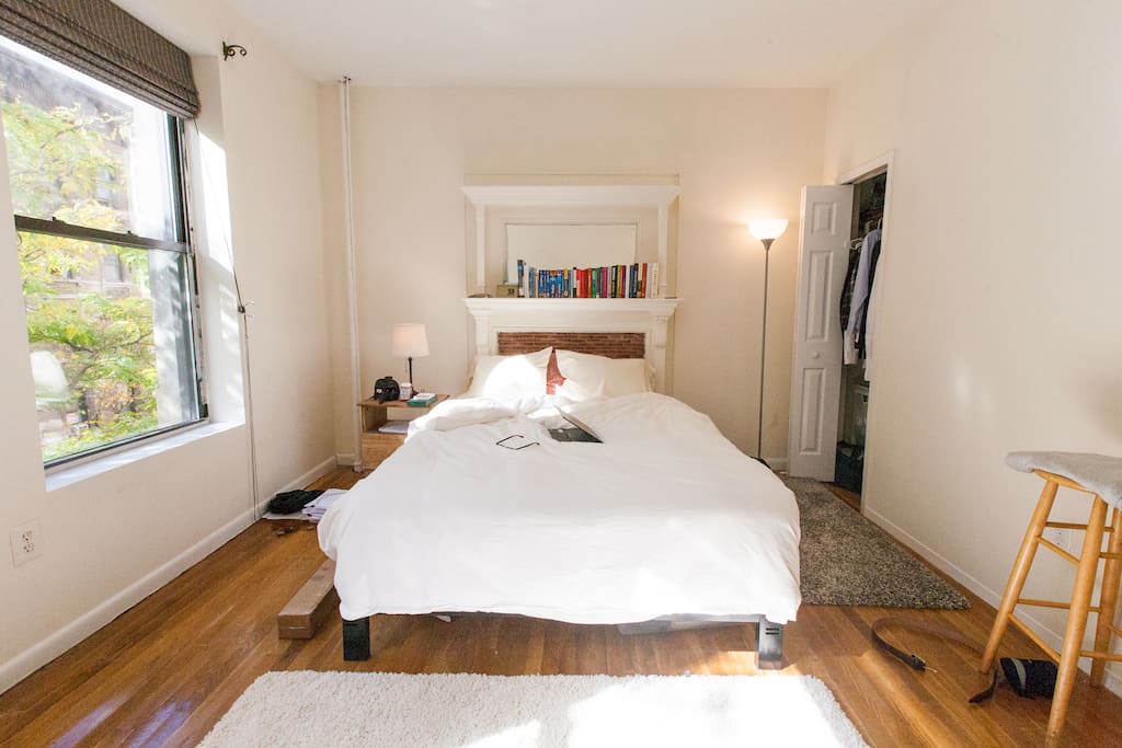 The queen-size bed framed by a fireplace centerpiece. The mattress is firm base with Euro pillowtop - very comfy!