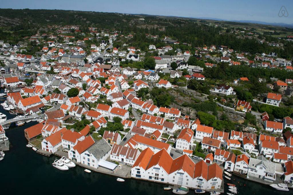 The old town of Skudeneshavn is a popular destination for tourists from all over the world. The old chapel is located in the center of the picture.