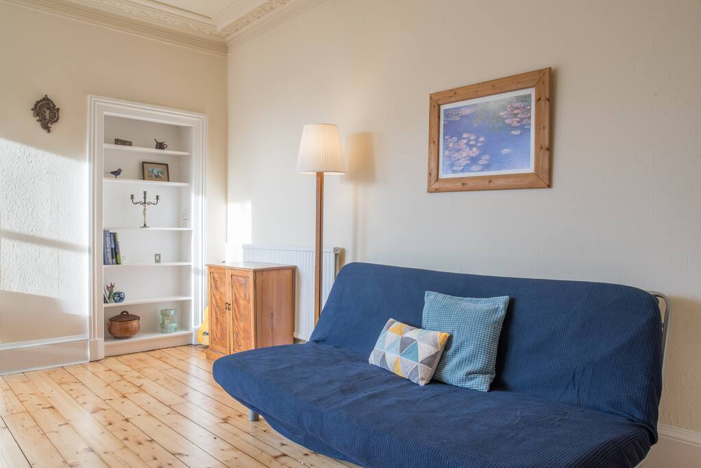 Sofa bed in large room with turret