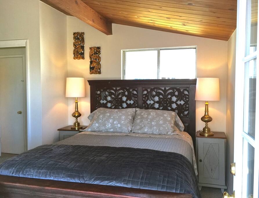 The master bedroom opens to the deck overlooking the San Lucias.