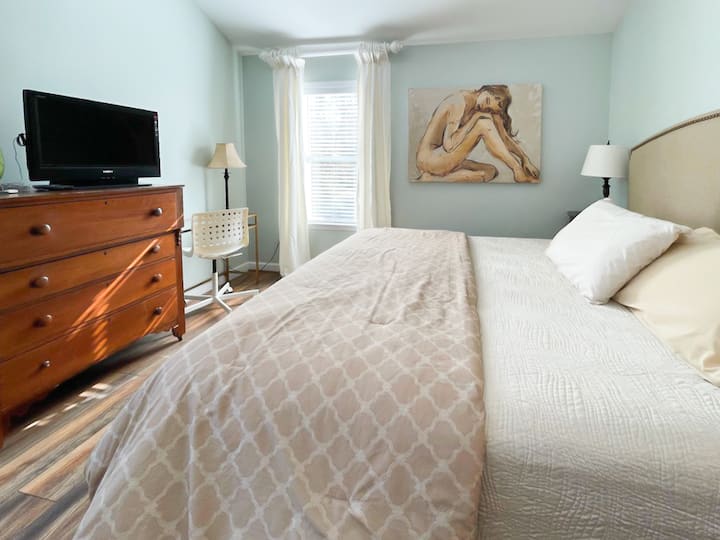 Huge king bed, large windows with blinds and curtains