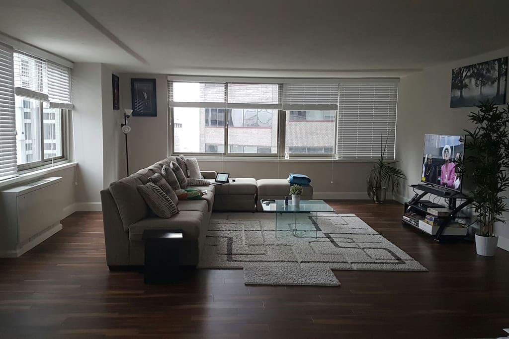 spacious living area which is a shared space has a great city view and dual view cable TV