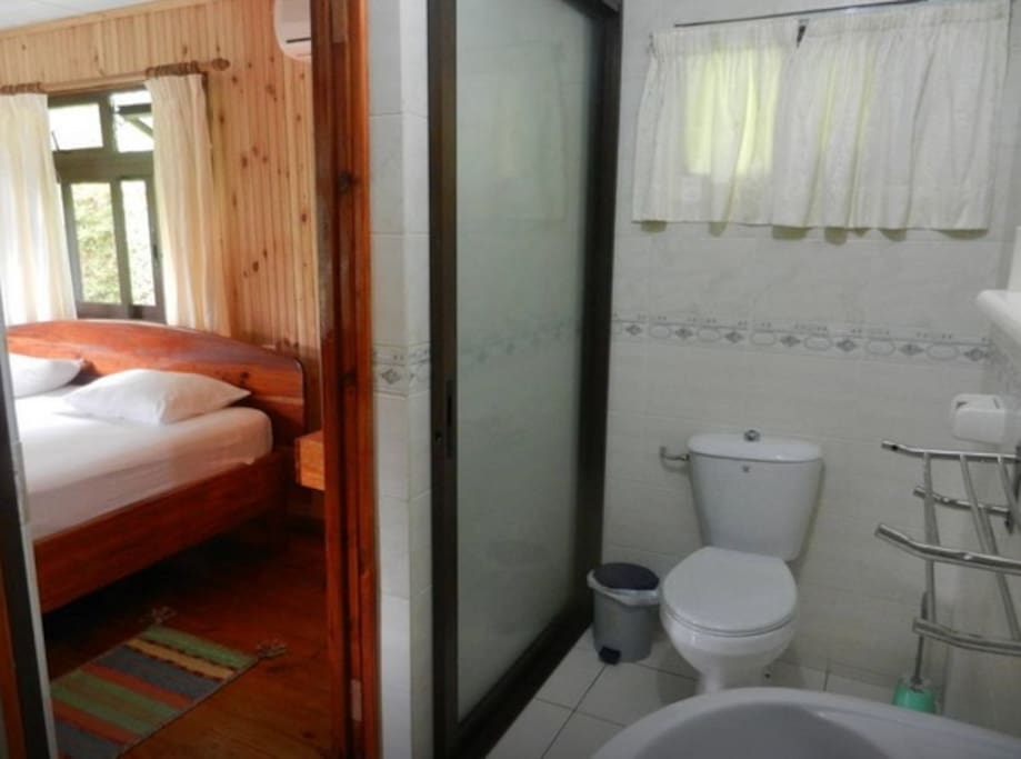 Bathroom is next to the bedroom