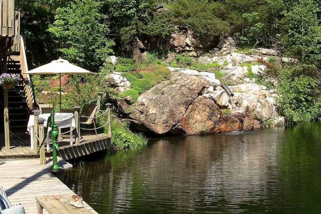 Cottage Home alongside Quarry Pond with waterfall.